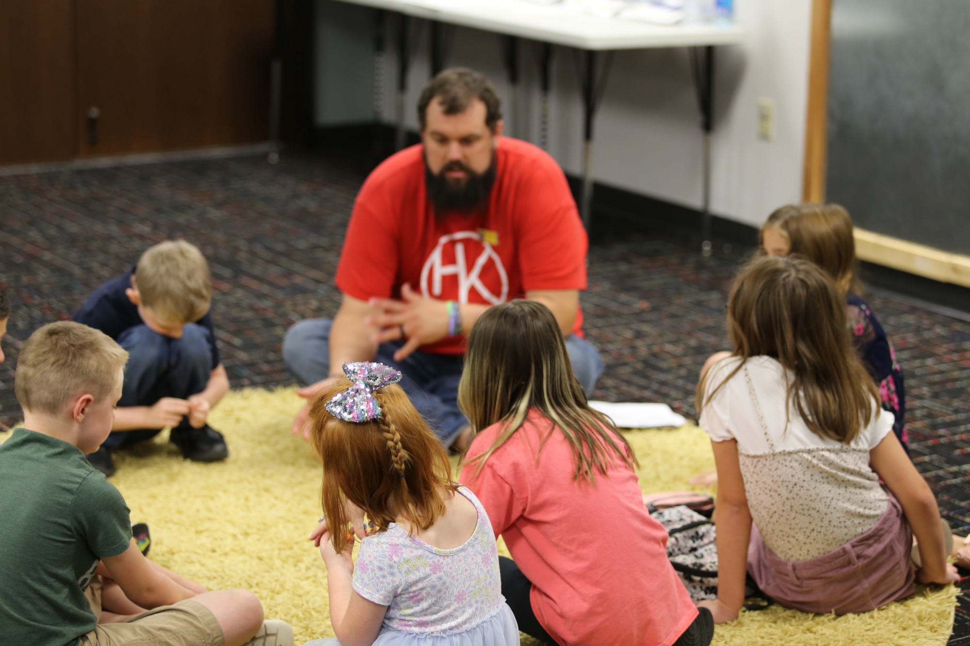 A leader and kids together at Harvest Kids